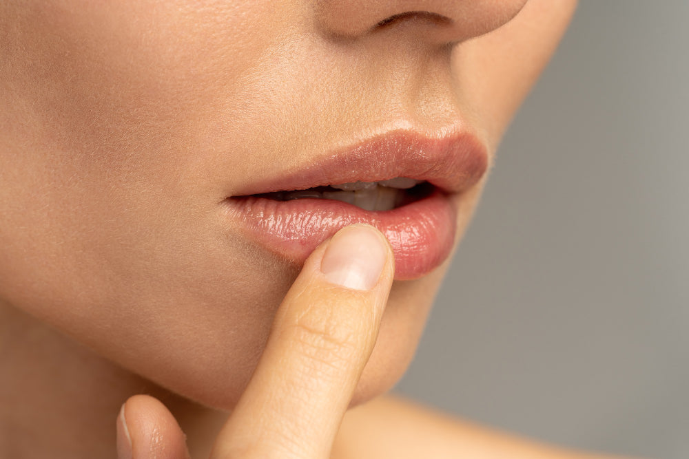 files/close-up-woman-applying-moisturizing-nourishing-balm-her-lips-with-her-finger.jpg
